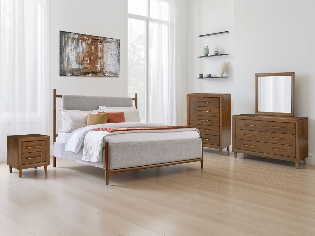 Signature Design by Ashley upholstered bed with padded headboard and sleek frame, showcasing stylish and comfortable bedroom furniture.