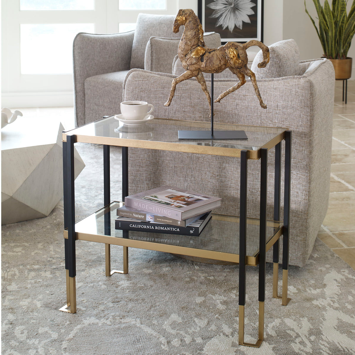 Uttermost Kentmore glass console table with sleek metal frame and clear glass top for modern home decor.