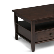 Handcrafted Warm Shaker coffee table by Simpli-Home with a smooth wooden surface and sturdy legs.