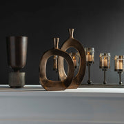 Set of two bronze textured vases by Uttermost, featuring a modern design and intricate surface details for stylish home décor.