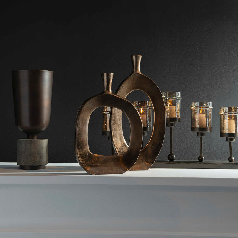 Set of two bronze textured vases by Uttermost, featuring a modern design and intricate surface details for stylish home décor.