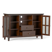 Artisan handcrafted tall TV media stand by Simpli-Home with open shelves and storage compartments in natural wood finish.