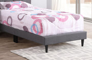Button tufted upholstered bed by Glory Furniture, featuring a cozy design with charming tufted details in a warm, inviting style.