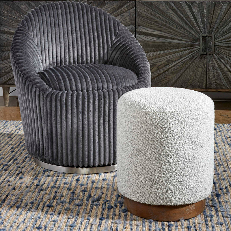 Uttermost Avila accent ottoman with plush fabric and wooden legs, versatile for living room or bedroom decor.