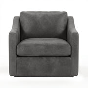 Classic Home Kipton swivel chair with a modern design, featuring a cushioned seat and a sturdy base in a cozy living room setting.