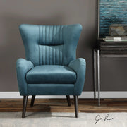 Blue mid-century accent chair by Uttermost with wooden legs and cushioned seat, stylish and comfortable for modern living spaces.