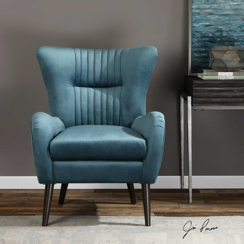 Blue mid-century accent chair by Uttermost with wooden legs and cushioned seat, stylish and comfortable for modern living spaces.