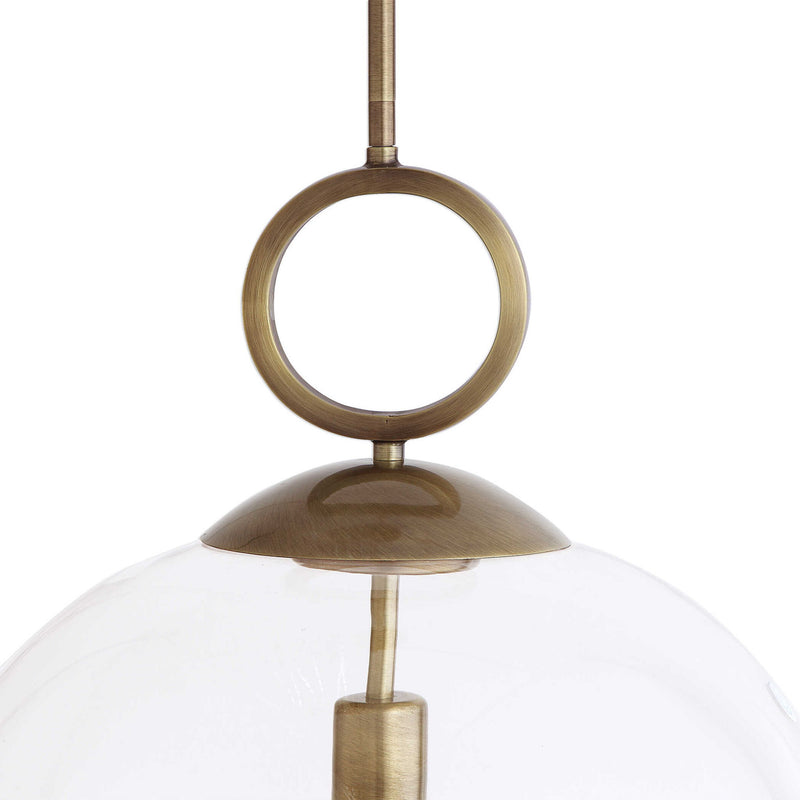 Large white blown glass pendant light by Uttermost, featuring a single light bulb and modern pendant lighting design.