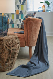 Gayelery throw blanket by Signature Design by Ashley®, soft fabric with a cozy, textured pattern in neutral tones.