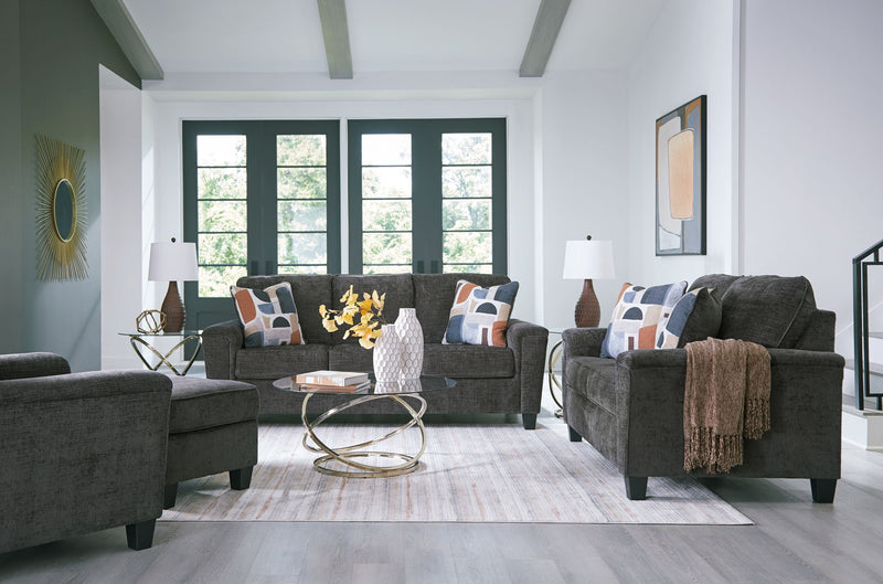 Benchcraft® Erinslane living room set with stationary chair and matching ottoman, featuring plush upholstery and contemporary design.