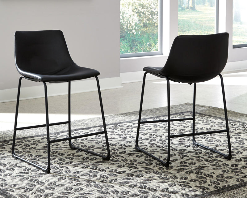 Set of two Signature Design by Ashley® Centiar upholstered barstools with padded seats and backrests for comfortable seating.