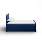 TOV Furniture Briella trundle bed with wooden frame and white finish, featuring a pull-out sleeping drawer for extra bedding space.