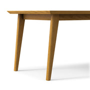 Simpli-Home Draper rectangular dining table with wood top and sturdy legs, ideal for family meals and gatherings.
