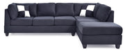 Glory Furniture Malone Comfort Sectional sofa with plush cushions and neutral fabric upholstery in a modern living room setting.