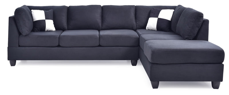 Glory Furniture Malone Comfort Sectional sofa with plush cushions and neutral fabric upholstery in a modern living room setting.