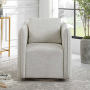 Corben silver swivel armchair by Uttermost featuring a modern design with a cushioned seat and swivel base.