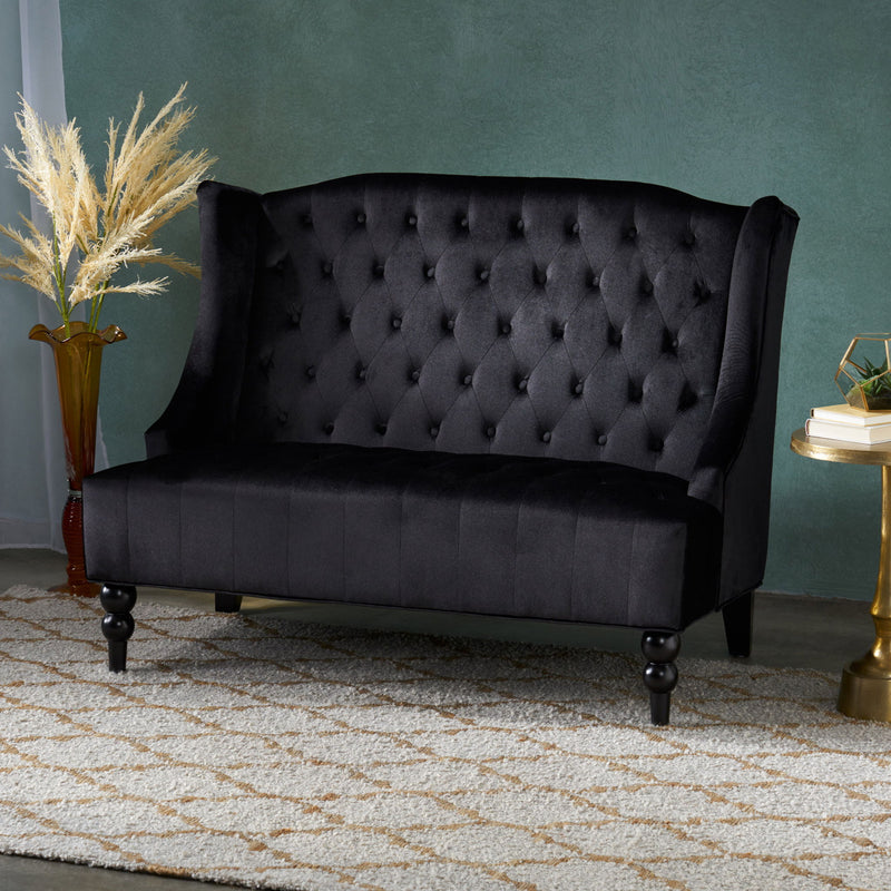 Noble House upholstered loveseat with wing back and diamond tufting, featuring plush seating and elegant design.