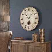 Harrison Gray wall clock by Uttermost featuring a modern design with a round face and metal frame.
