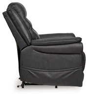 Signature Design by Ashley Oatman power lift recliner in beige fabric with padded armrests and plush cushioning.