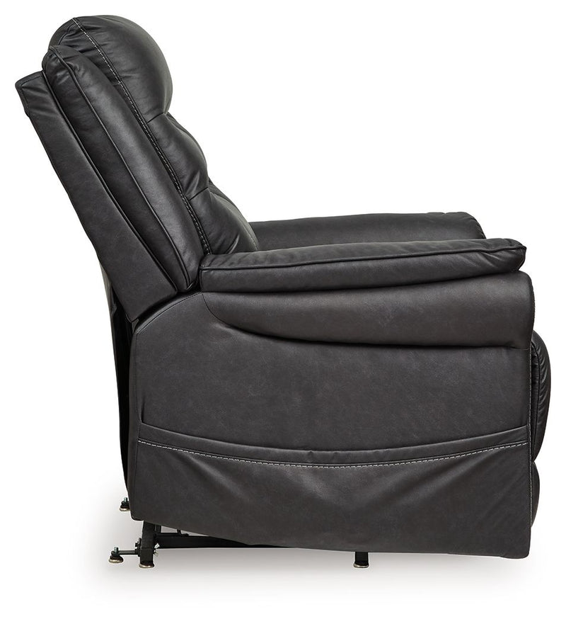 Signature Design by Ashley Oatman power lift recliner in beige fabric with padded armrests and plush cushioning.