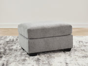 Benchcraft® upholstered ottoman with plush cushioning and fabric upholstery, ideal for living room or seating area.