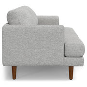 Livingston upholstered stationary sofa by Simpli-Home with plush fabric and cushioned armrests in a modern living room setting.