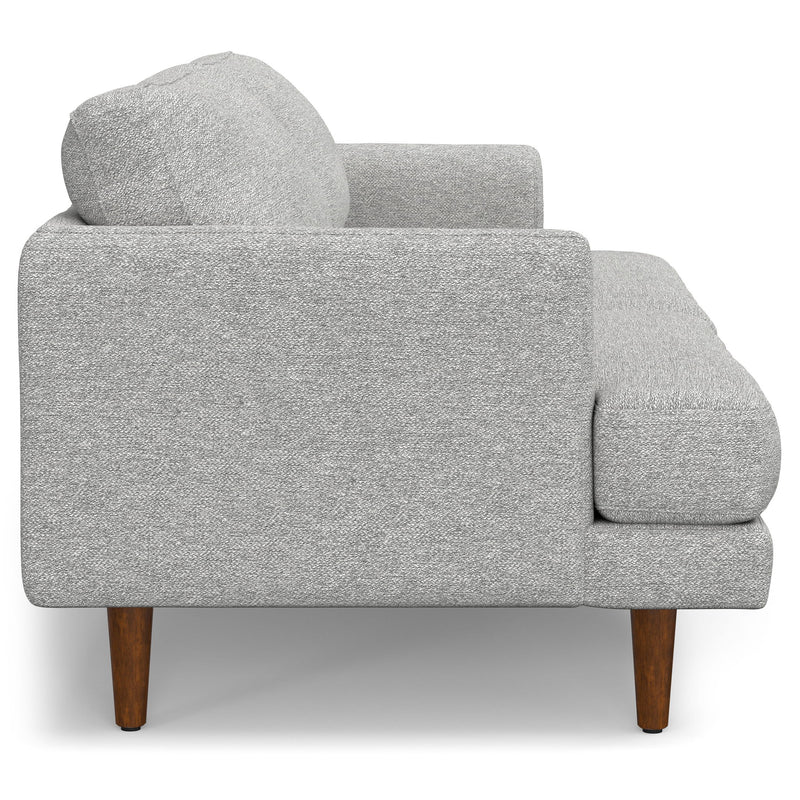 Livingston upholstered stationary sofa by Simpli-Home with plush fabric and cushioned armrests in a modern living room setting.