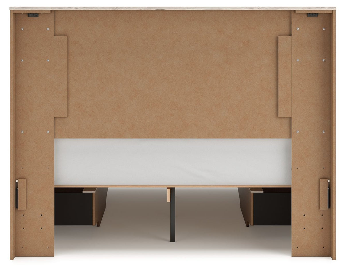 Signature Design by Ashley Lawroy panel bed with built-in storage drawers in a modern bedroom setup.