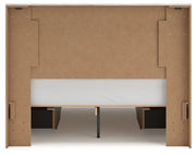 Signature Design by Ashley Lawroy panel bed with built-in storage drawers in a modern bedroom setup.