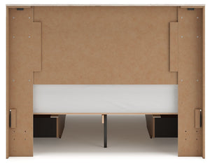 Signature Design by Ashley Lawroy panel bed with built-in storage drawers in a modern bedroom setup.