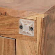 Handcrafted boho wooden sideboard with three carved doors, natural finish, showcasing artisanal texture and rustic charm.