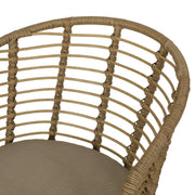 Brown wicker arm chair with beige water-resistant cushions from Noble House, modern design perfect for outdoor or indoor use.