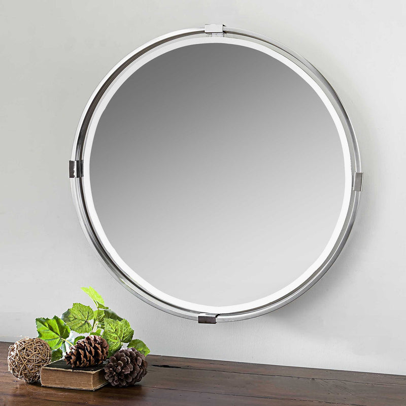 Uttermost Tazlina round wall mirror with brushed nickel finish, featuring a sleek, modern design for contemporary interiors.