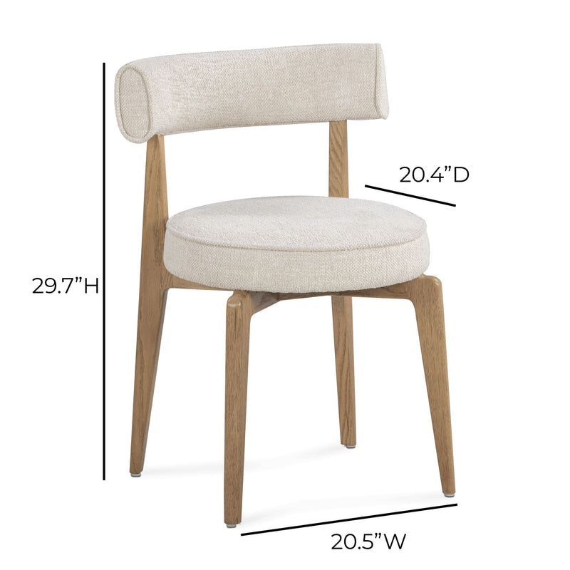 Cream fabric Nikita side dining chair by TOV Furniture featuring a sleek, modern design with a cushioned seat and wooden legs.
