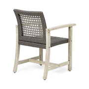 Set of two Noble House outdoor dining chairs with acacia wood frames, featuring slatted seats and armrests for patio comfort.