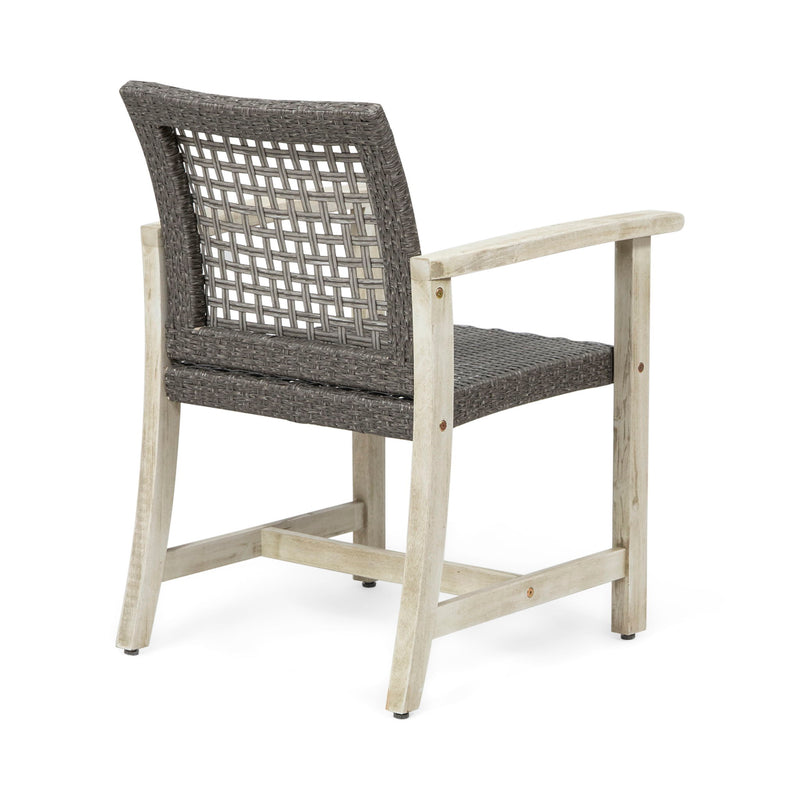 Set of two Noble House outdoor dining chairs with acacia wood frames, featuring slatted seats and armrests for patio comfort.