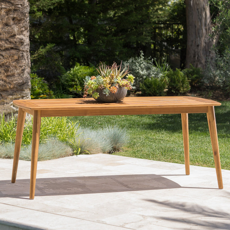 Outdoor dining table with teak frame from Noble House, showcasing a spacious surface ideal for outdoor meals and gatherings.