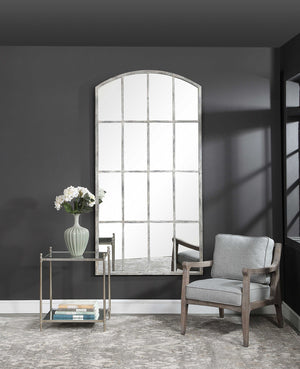 Ivory arched wall mirror by Uttermost featuring an elegant curved frame, ideal for enhancing any living space.