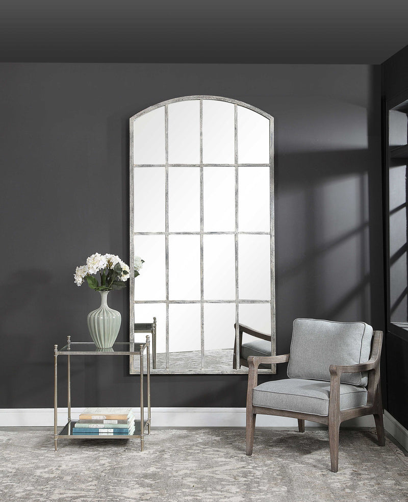 Ivory arched wall mirror by Uttermost featuring an elegant curved frame, ideal for enhancing any living space.