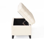 Noble House Juliana storage ottoman with birch legs, upholstered in fabric, showing its cushioned top and wooden legs.