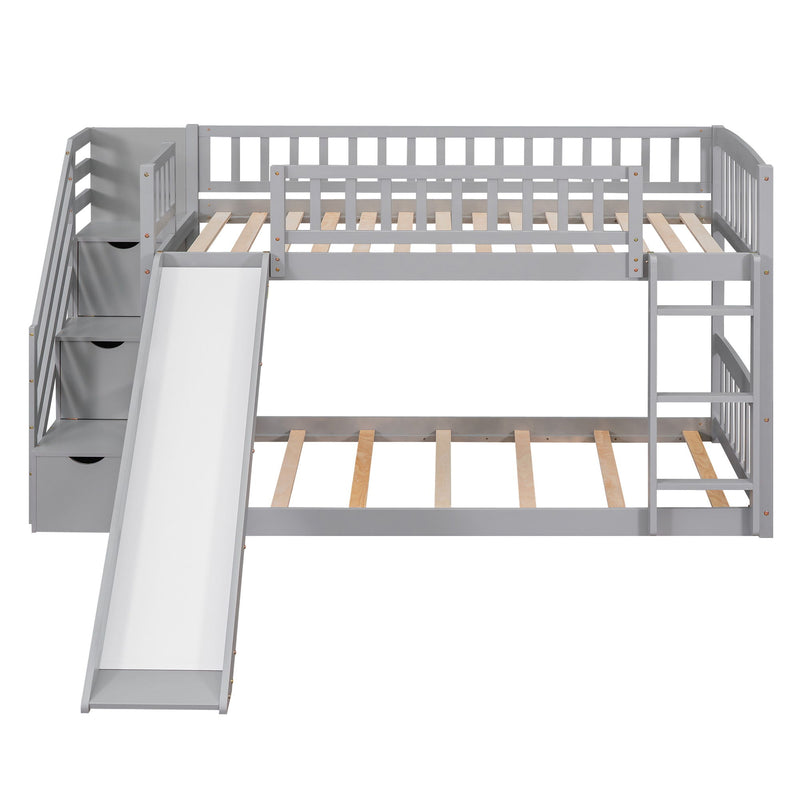 Gray twin over twin bunk bed with stairway, two drawers, and slide by DreamHaus, featuring a sturdy frame and built-in storage.