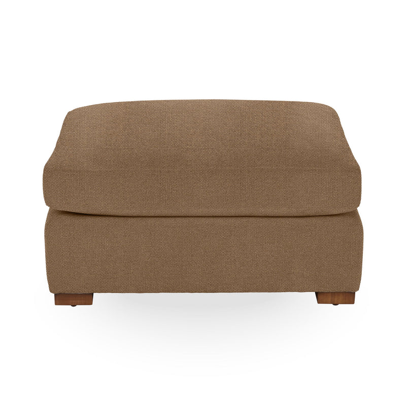 Classic Home Audrey upholstered ottoman with plush fabric and wooden legs, serving as a stylish and functional accent piece.