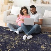 Maval - 6' X 9' Washable Area Rug - Black / Gold - R&R Furniture Gallery (Fountain Valley, CA)