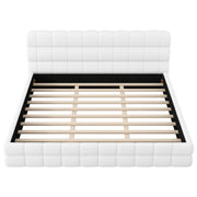 Dreamland upholstered platform bed with padded headboard, showcasing a modern, plush design in a cozy bedroom setting.
