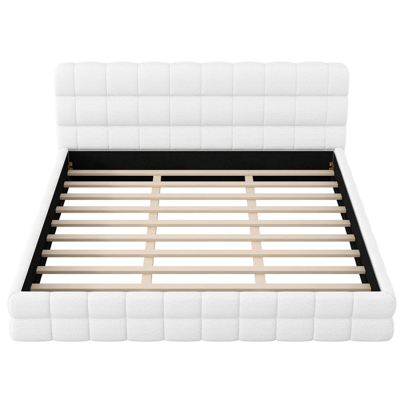 Dreamland upholstered platform bed with padded headboard, showcasing a modern, plush design in a cozy bedroom setting.