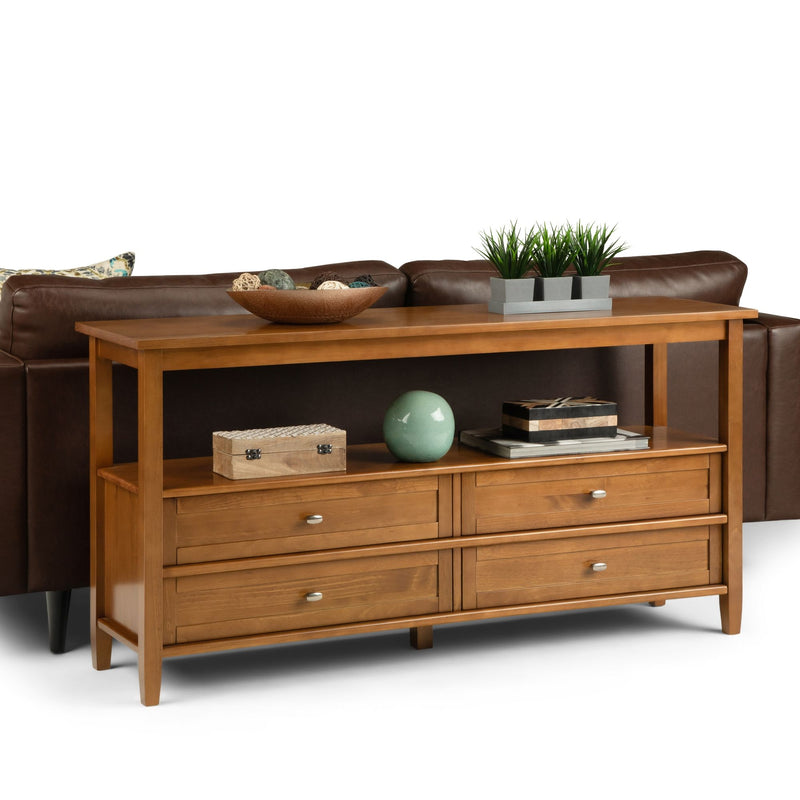 Warm Shaker wide console sofa table by Simpli-Home with light golden brown finish, featuring a sleek, modern design and spacious surface.