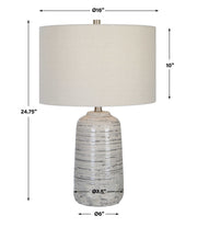 Uttermost Cyclone ivory table lamp featuring a textured ceramic base and fabric shade, ideal for modern or classic decor.