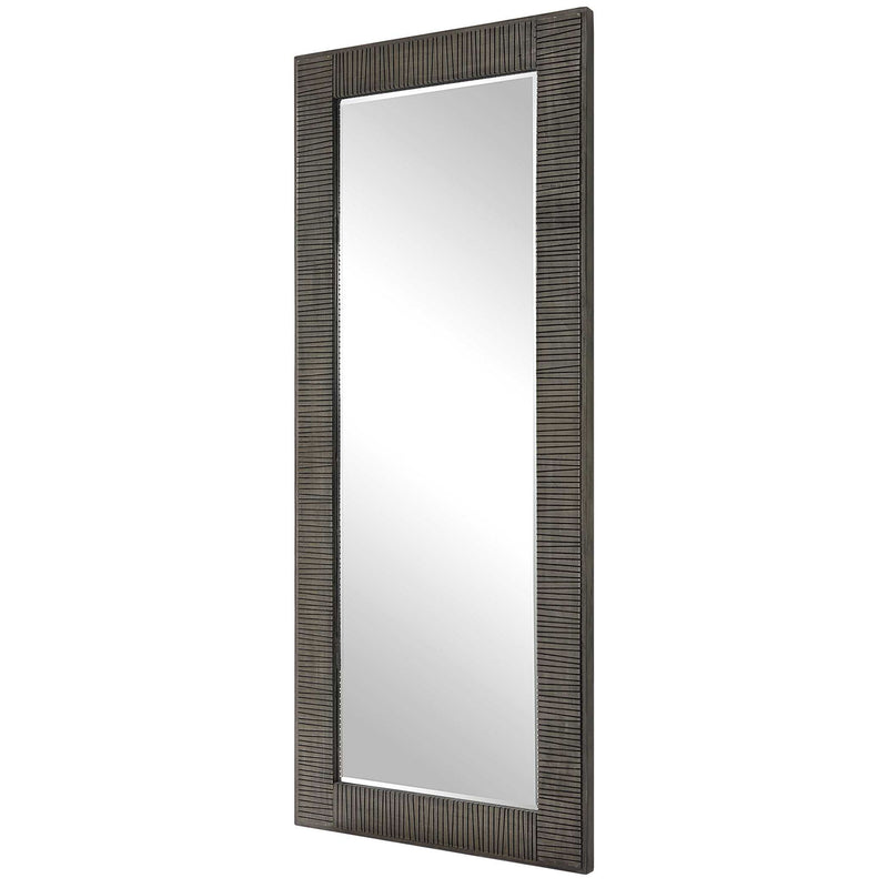 Gray Figaro oversized accent mirror by Uttermost with a bold, modern frame, hanging on a wall in a stylish interior space.