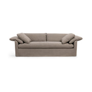 Classic Home Cassiano slip cover sofa in a stationary style with a neutral fabric finish, showcasing a comfortable living room setup.