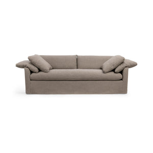 Classic Home Cassiano slip cover sofa in a stationary style with a neutral fabric finish, showcasing a comfortable living room setup.